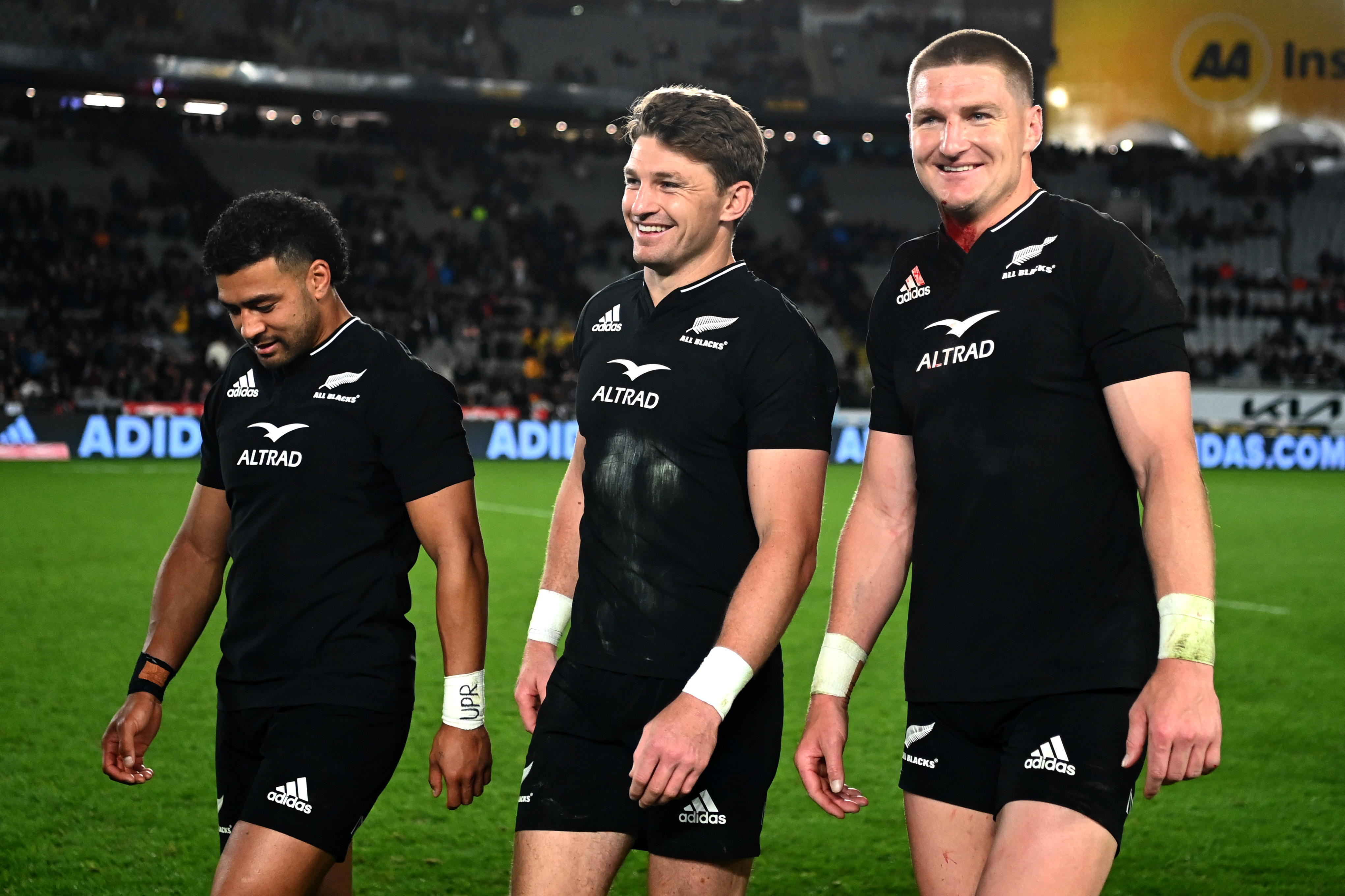 AUCKLAND, NEW ZEALAND - SEPTEMBER 24: Richie Moâ  unga, Beauden Barrett and Jordie Barrett of the All Blacks celebrate after winning The Rugby Championship and Bledisloe Cup match between the New Zealand All Blacks and the Australia Wallabies at Eden Park on September 24, 2022 in Auckland, New Zealand. (Photo by Hannah Peters/Getty Images)